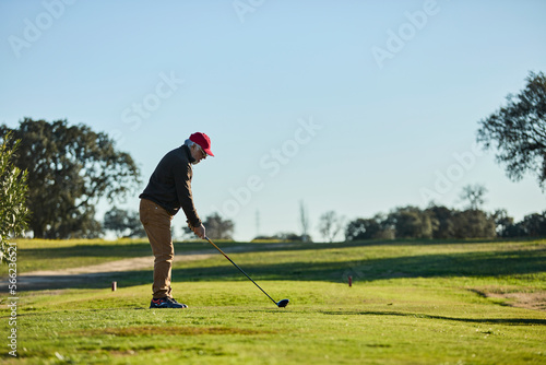 senior man playing golf