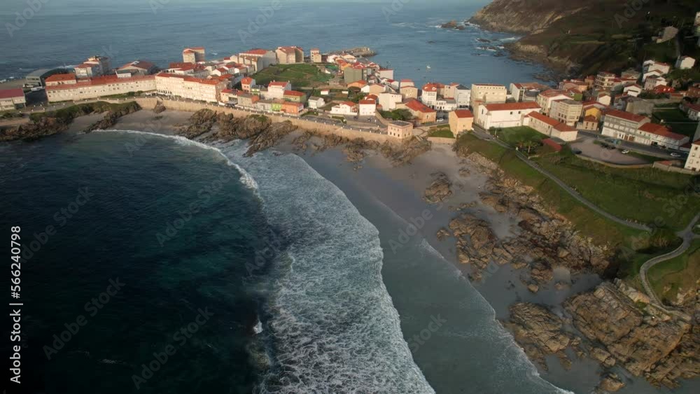 Aerial View Of Ocean Waves On The Beach And Residential Houses Aerial View Of Ocean Waves On The Beach And Residential Houses