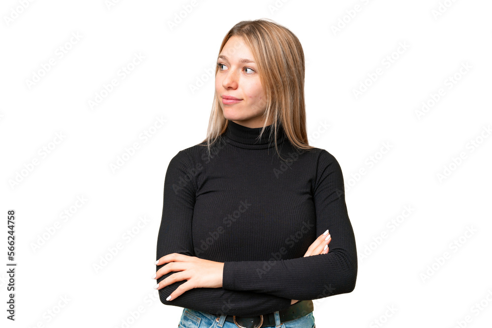 Young pretty blonde woman over isolated chroma key background looking to the side Young pretty blonde woman over isolated chroma key background looking to the side
