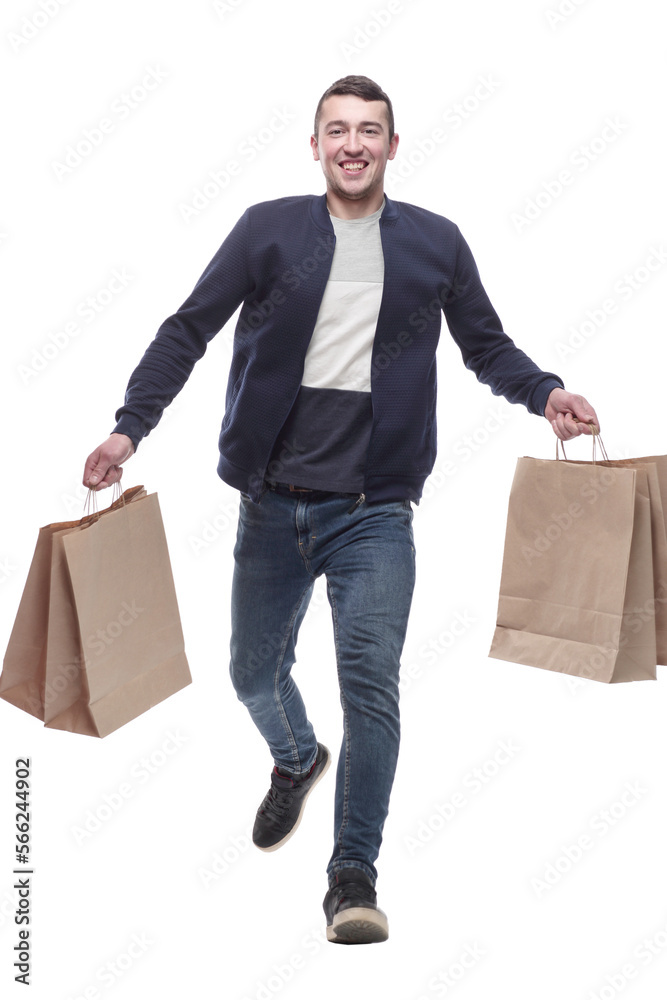 young man with shopping bags striding forward young man with shopping bags striding forward