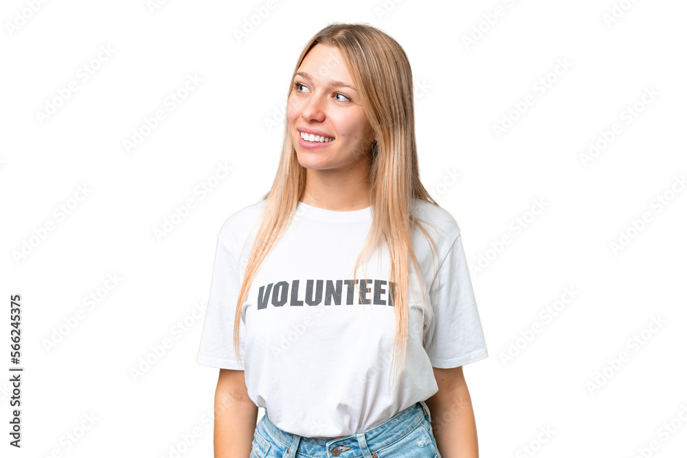 Young volunteer woman over isolated chroma key background looking side Young volunteer woman over isolated chroma key background looking side
