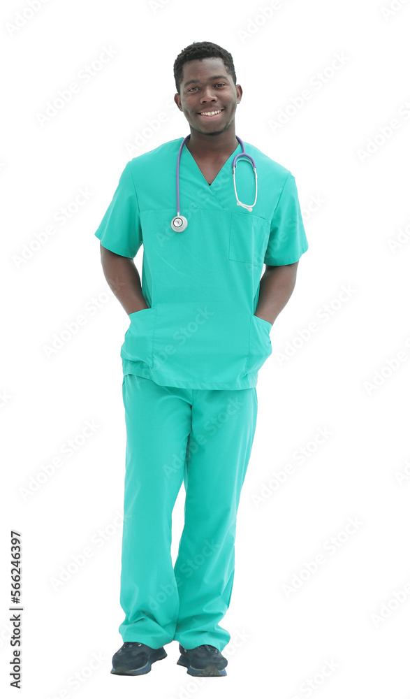 in full growth. smiling doctor in blue uniform. in full growth. smiling doctor in blue uniform.