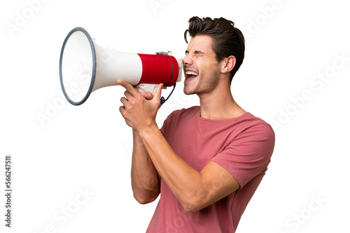 Young handsome caucasian man over isolated background shouting through a megaphone
