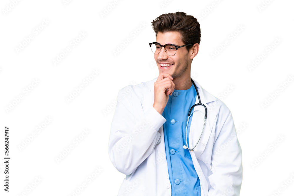 Young doctor man over isolated background looking to the side Young doctor man over isolated background looking to the side