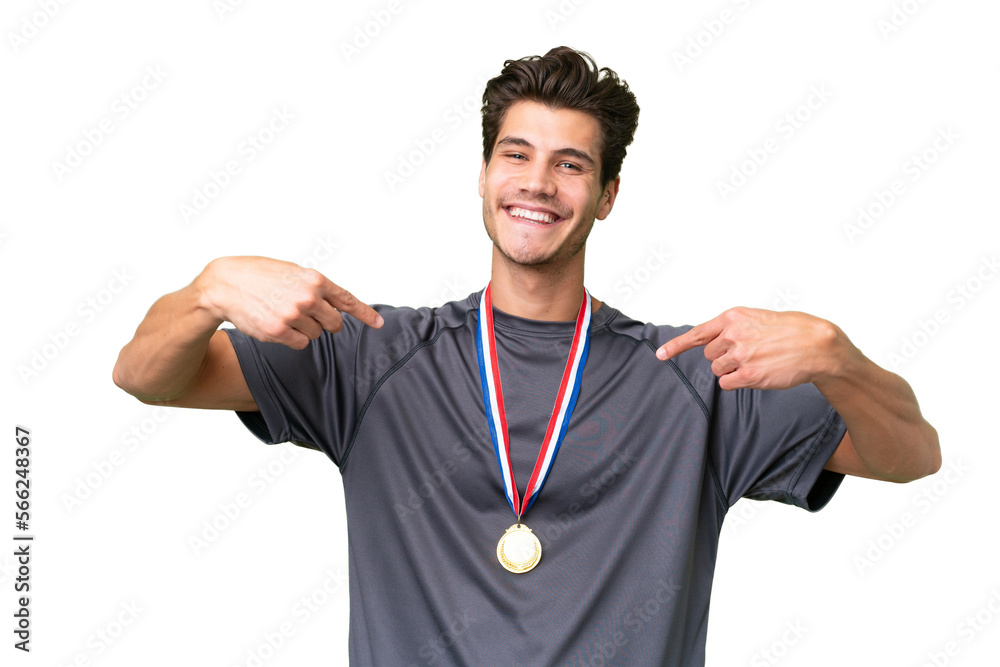 Young caucasian man with medals over isolated background proud and self-satisfied Young caucasian man with medals over isolated background proud and self-satisfied