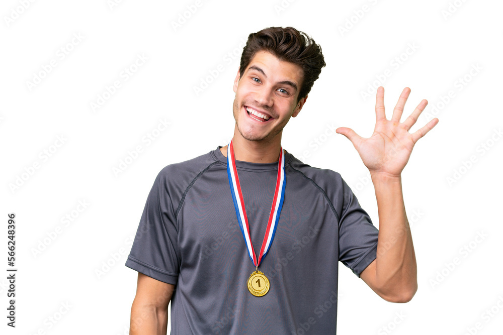 Young caucasian man with medals over isolated background counting five with fingers Young caucasian man with medals over isolated background counting five with fingers