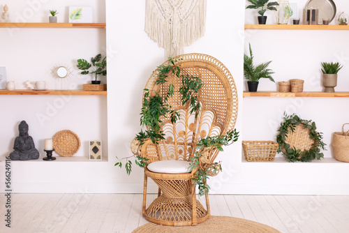 Wallpaper Mural Design peacock wicker chair and wooden shelfs with decor in stylish bedroom interior. Rattan peacock armchair by the white wall in the living room. Wabi sabi room interior. Eco natural furniture.	 Torontodigital.ca