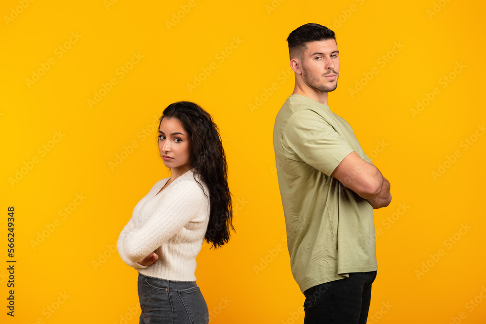 Fototapeta premium Sad offended young middle eastern woman ignores boyfriend in casual with crossed arms, think about divorce
