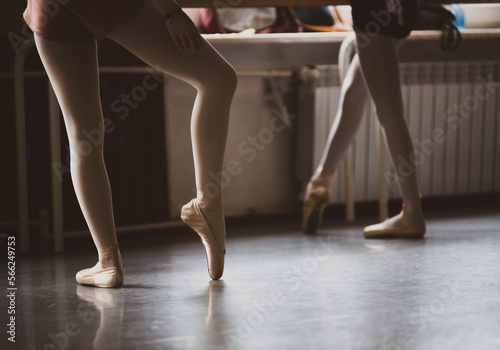 legs of ballet dancer in ballet pose in a class, vintage image