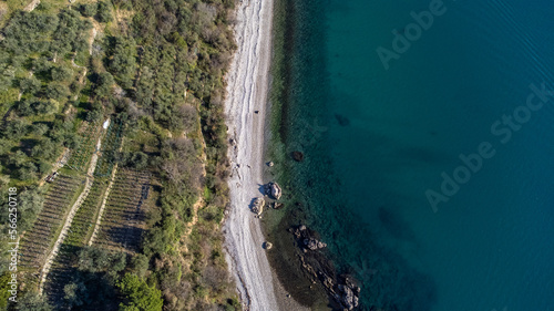 Fantastic landscape taken from the drone at the top of the cliff. Trieste, Italy. Clear sea and blue sky. Rocks and sand.