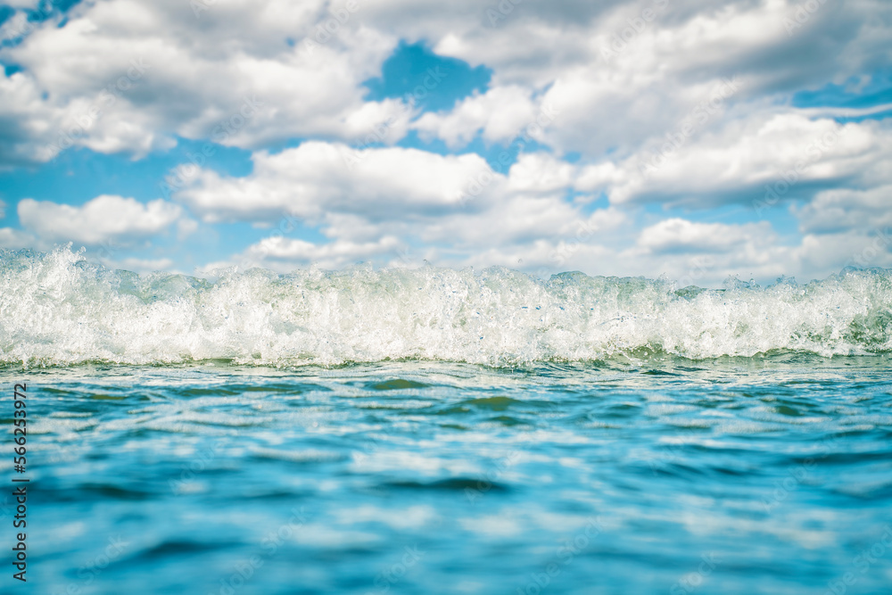 Sea surface with small waves and cloudy sky on the horizon. Sea surface with small waves and cloudy sky on the horizon.