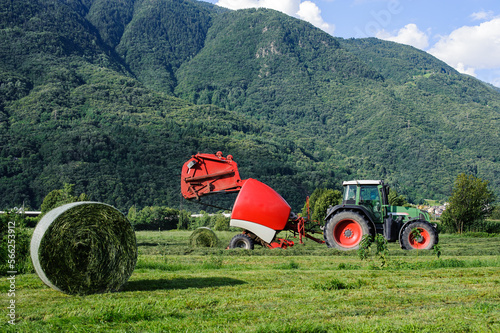 Tractor with round baler