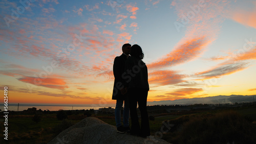 Silhouette of couple hug against the sunset sky © Polonio Video