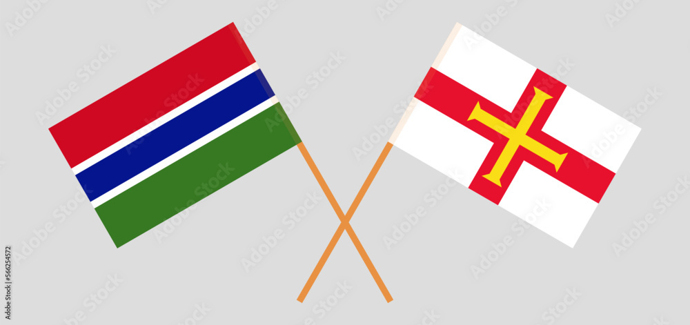 Crossed flags of the Gambia and Bailiwick of Guernsey. Official colors. Correct proportion