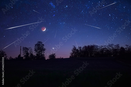Starry Milky Way skies with comet and meteor shower, falling and shooting stars. photo