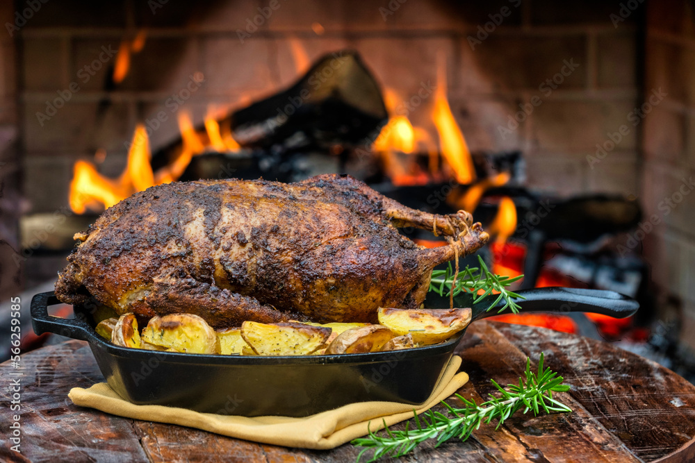 Roasted Duck and Golden Potatoes cooked on a cast iron skillet