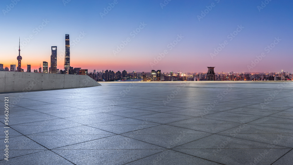 Empty square floor and city skyline with modern buildings at sunrise in Shanghai, China. High Angle view.