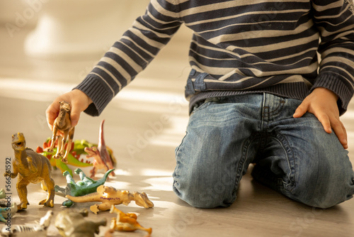 Little toddler child, boy, pee in his pants while playing with toys, child distracted and forget to go to the toilet