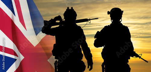 Silhouettes of a soldiers with United Kingdom flag on background of sky. Background for Remembrance Day. United Kingdom Armed Forces concept. EPS10 vector