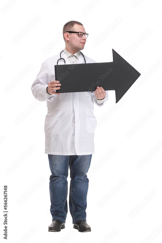 Front view of young smiling doctor holding a black arrow pointing right Front view of young smiling doctor holding a black arrow pointing right