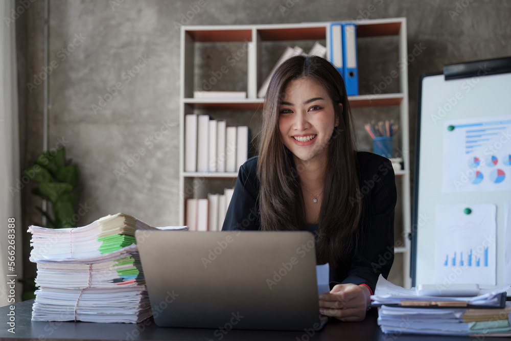 Beautiful Business woman working at home office and analyze financial report document. Accounting and Finance concept Beautiful Business woman working at home office and analyze financial report document. Accounting and Finance concept
