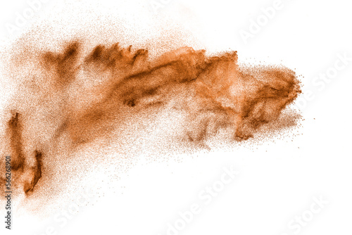 Brown colored sand splash.Dry river sand explosion isolated on white background. photo