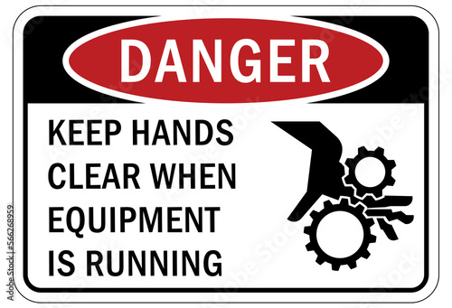 machine hazard sign and labels keep hands clear when equipment is running