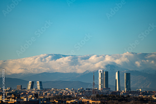 City of Madrid with the towers of Castellana street and the Navacerrada mountain with snow.