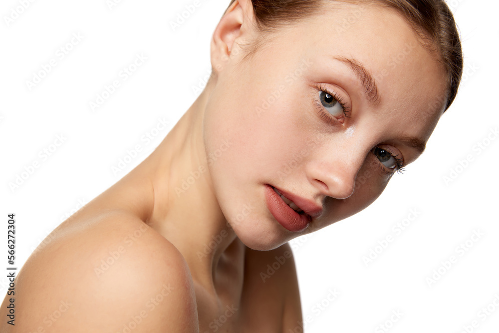 Half-length portrait of young beautiful girl without makeup on face. Model with bare shoulders. Concept of purity, skin care, beauty, spa, anti-aging procedures Half-length portrait of young beautiful girl without makeup on face. Model with bare shoulders. Concept of purity, skin care, beauty, spa, anti-aging procedures