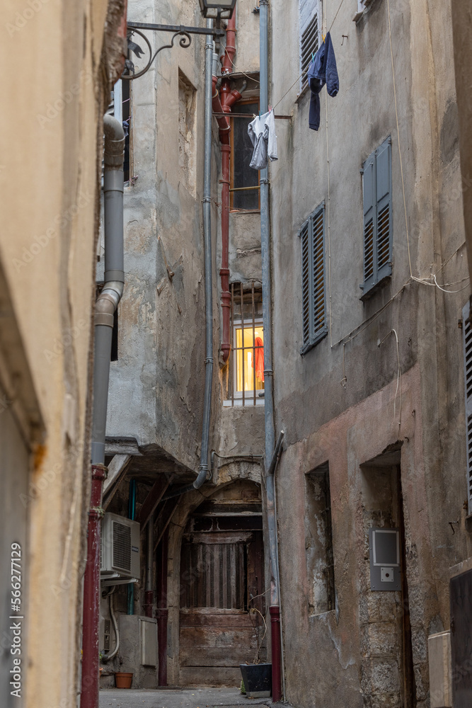 Narrow alley with window in Grasse, France