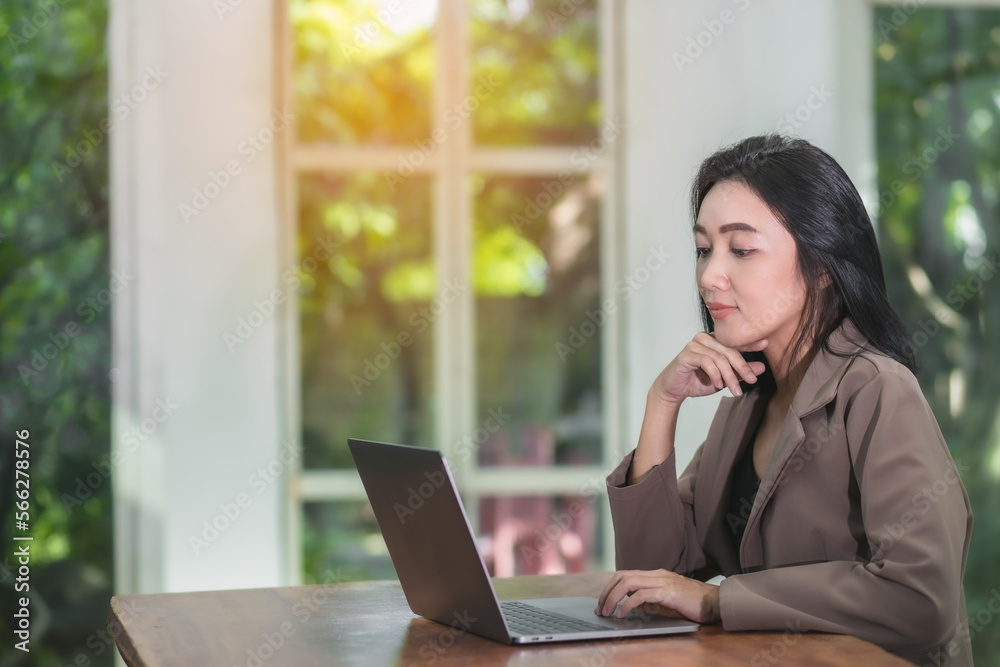 Young beautiful Asian woman working with laptop used the internet and shopped online, freelancer working businesswoman lifestyle concept Young beautiful Asian woman working with laptop used the internet and shopped online, freelancer working businesswoman lifestyle concept