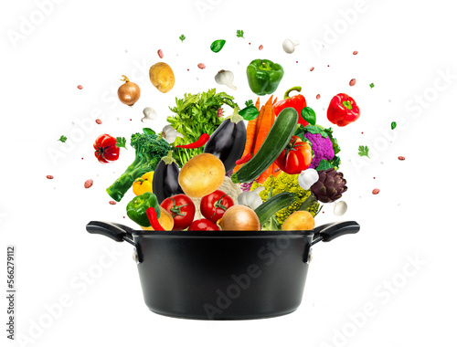 Healthy food in the pot. Studio shot of different types of vegetables isolated on transparent background. Concept cooking healthy food.