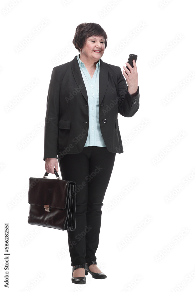 in full growth.Executive business woman with a smartphone. in full growth.Executive business woman with a smartphone.