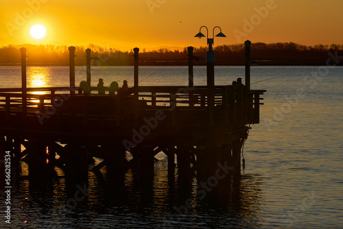 Sport Fishing Pier Morning. Fishermen on the No. 3 Road fishing pier in Richmond in the early morning light.

