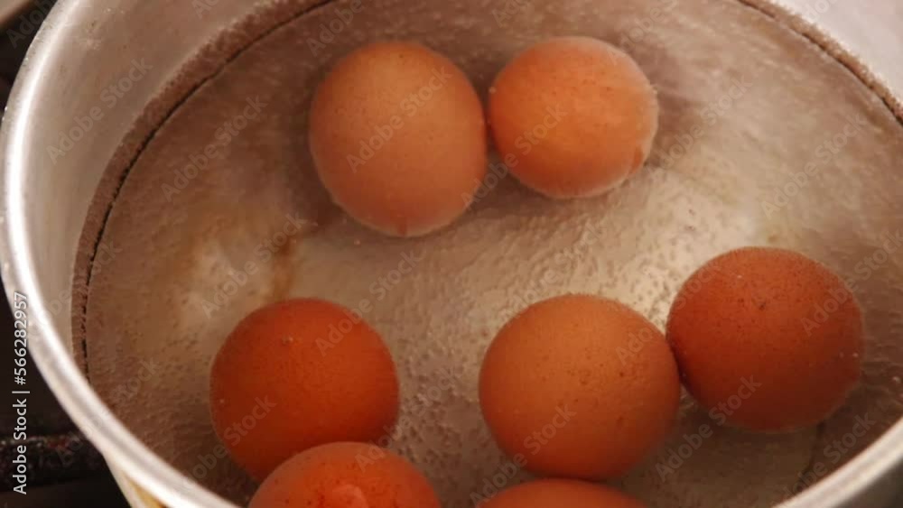 video of boiling eggs in a pot (close-up). Food preparation concept. video of boiling eggs in a pot (close-up). Food preparation concept.