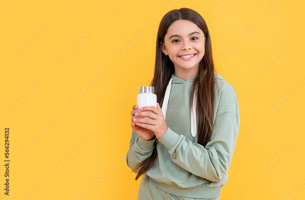 photo of teen girl with medication pill, copy space. teen girl with medication isolated on yellow. photo of teen girl with medication pill, copy space. teen girl with medication isolated on yellow.