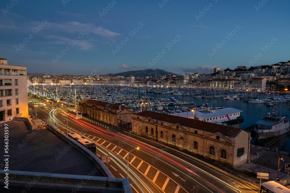 Marseille, Provence, France - View over the old port and the Major Avenue at dusk with colorful lights and ships