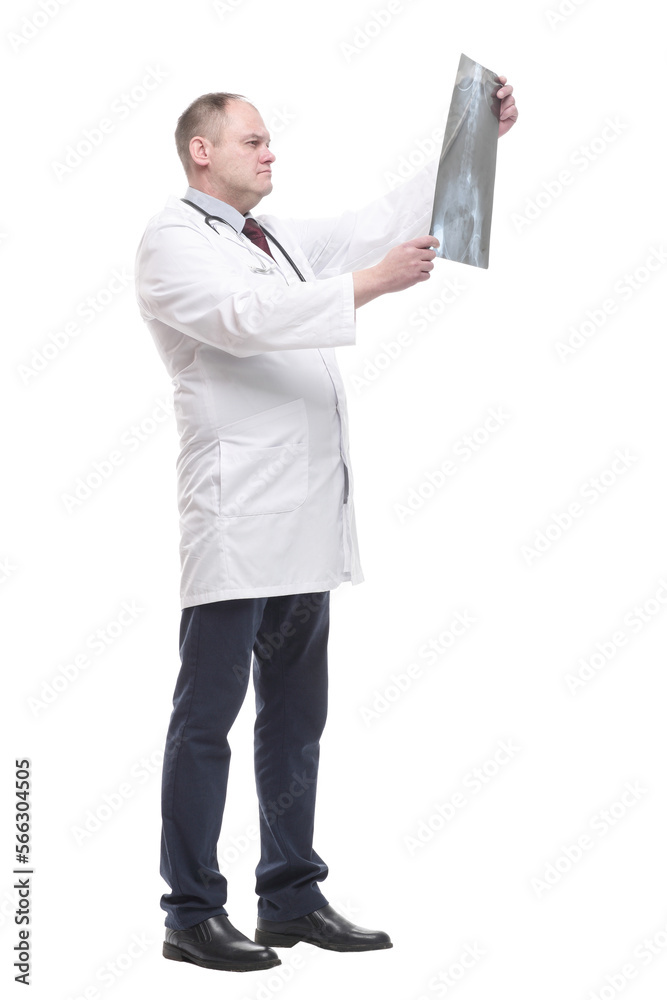 in full growth. qualified doctor looking at an x-ray . in full growth. qualified doctor looking at an x-ray .