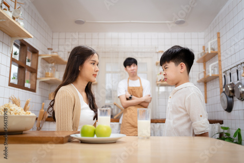 Εκτύπωση καμβά Mother yelling on her son in kitchen because his son deny to drink a milk and eat vegetables