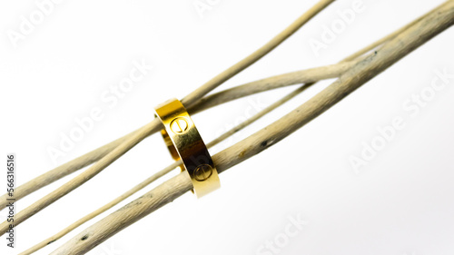 golden bracelet with a ring on a white background, jewelry concept. High quality photo