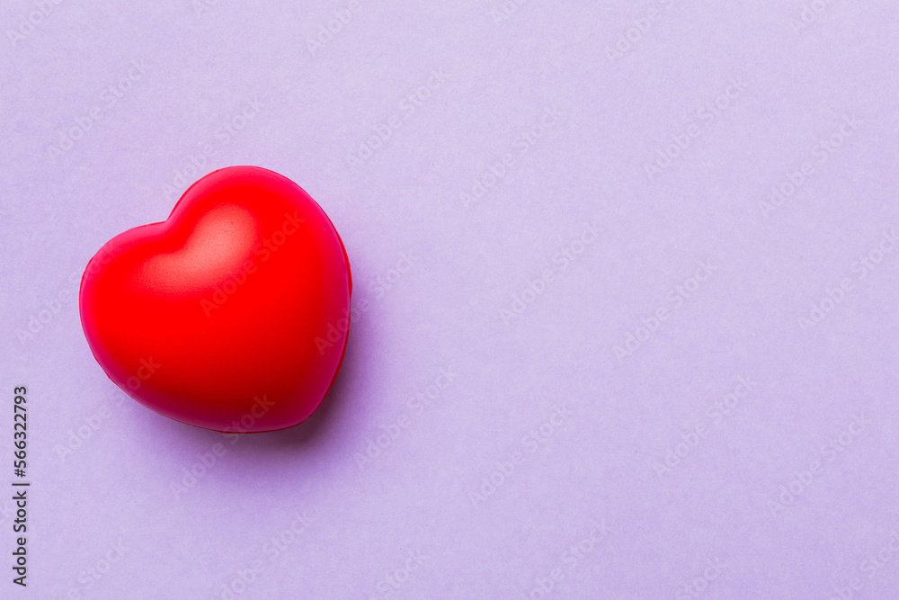 red heart shape on colored background. minimal concept top view with copy space red heart shape on colored background. minimal concept top view with copy space