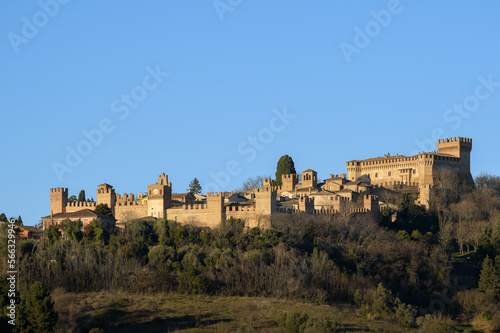 The castle of Gradara seen from afar with copy space in the sky. Gradara is a middle age italian village near Urbino famous for the stoy of Paul and Francesca in Dante Alighieri’s Divine Comedy