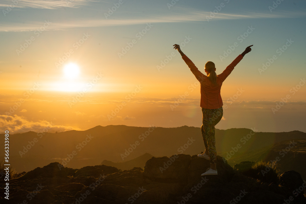 silhouette of a person in the mountains