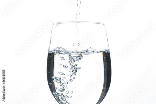 A glass of water on a white background. Close-up