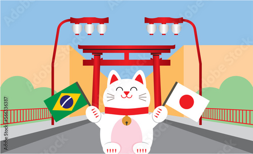 Gato da sorte japonês (maneki neko) segurando bandeiras do Brasil e Japão, simbolizando a amizade entre estes dois países. Ao fundo, portal e lanternas localizados no bairro da Liberdade, em São Paulo