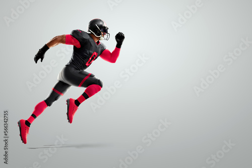 American Football player in red and black uniform in running pose on white background. American Football, advertising poster, template, blank, sports. 3D illustration, 3D rendering.