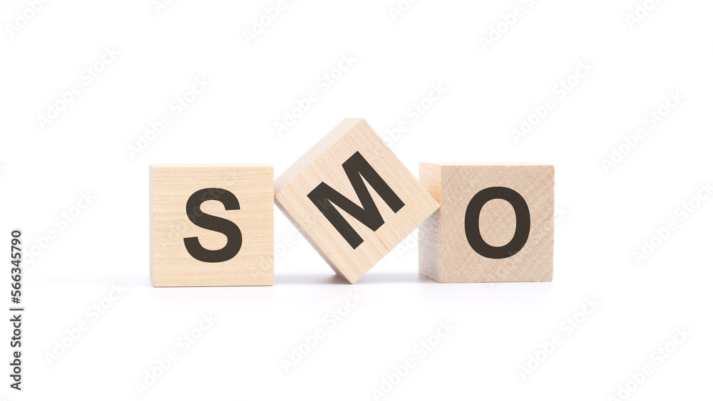 SMO - acronym from wooden blocks with letters, social media optimization concept, top view on white background SMO - acronym from wooden blocks with letters, social media optimization concept, top view on white background