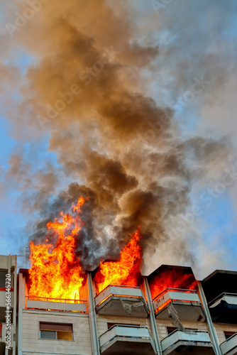 Fire in an attic of a building in an Italian city. Apartment on fire and flames