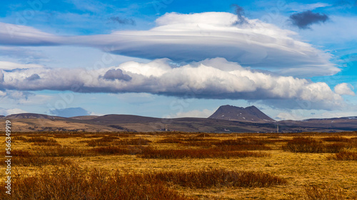 Unique phenomenon of a formed lenticular cloud (Altocumulus lenticularis) over a crater of volcano in the wild, empty scenery of southern Iceland, Europe