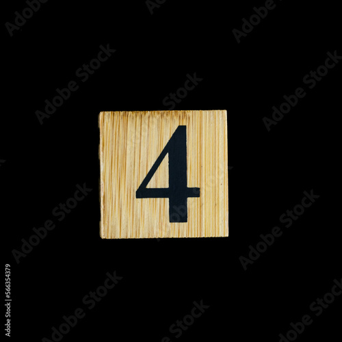 number 4 four wooden isolated on black background.